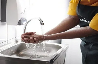 Debonairs employee washing hands